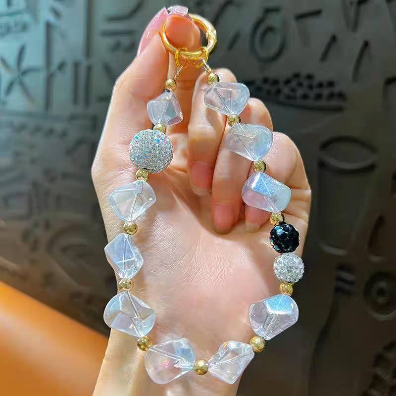 Creative Crystal & Diamond-encrusted Irregular-shaped Phone Charms for Women. These delicate and high-end adornments double as mobile phone case pendants and car keychains
