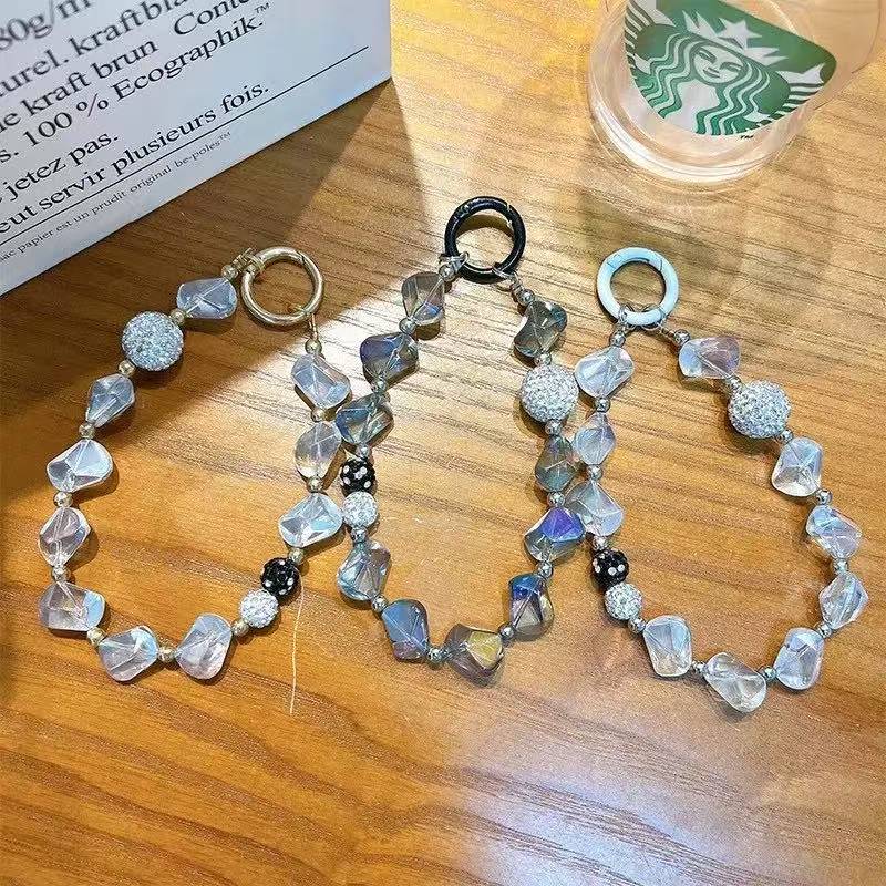 Creative Crystal & Diamond-encrusted Irregular-shaped Phone Charms for Women. These delicate and high-end adornments double as mobile phone case pendants and car keychains